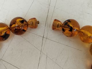 Antica collana in ambra con inserti in argento