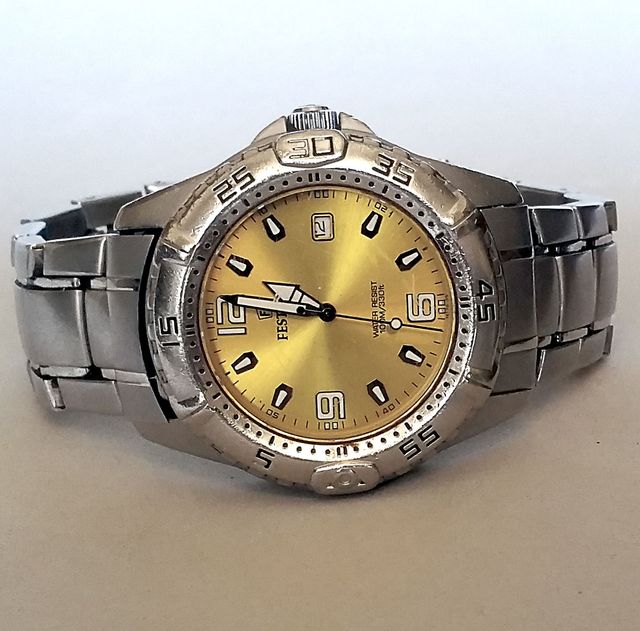 Festina. cuarzo, esfera amarillo.