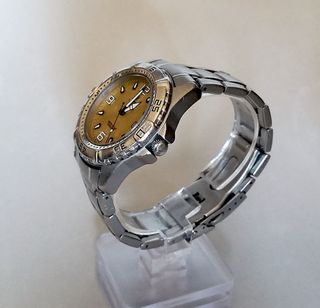 Festina. cuarzo, esfera amarillo.