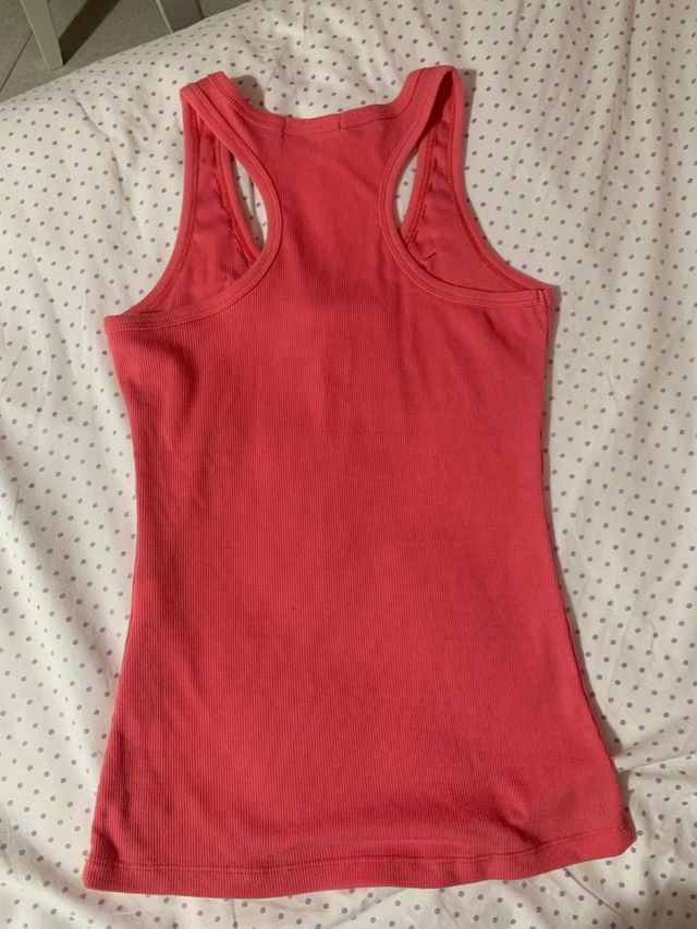 Canotta con fiocchi e brillantini color pesca