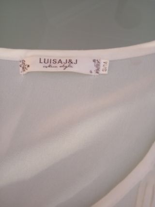 Blusa blanco roto con flecos 