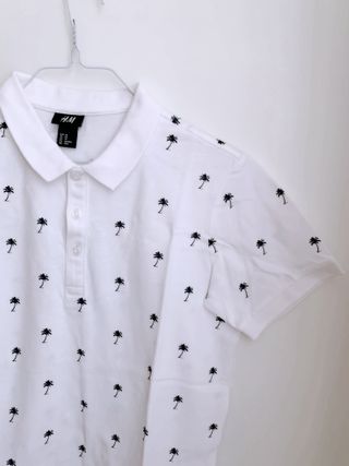 Polo bianca in cotone stampa palme