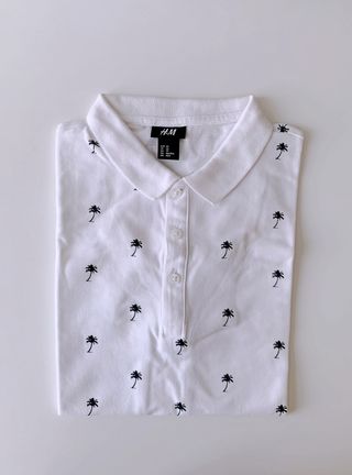 Polo bianca in cotone stampa palme