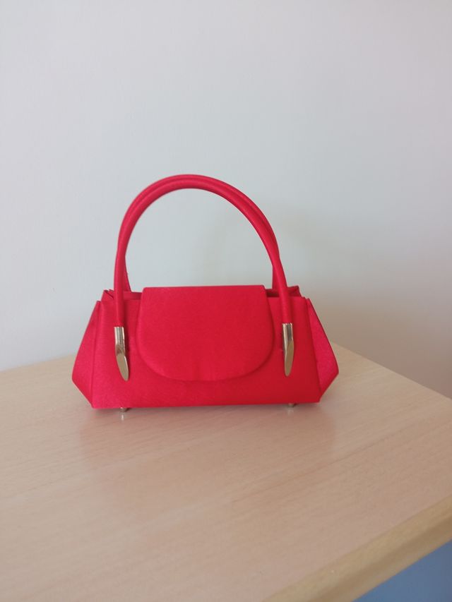 Bolsos de mano como lo colgado