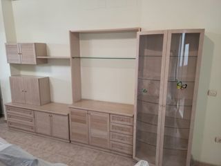 Mueble modular salón con mesa redonda extensible