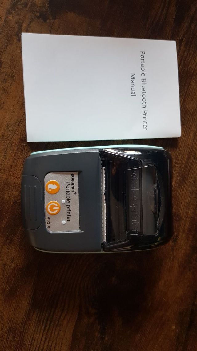 Mini stampante con rotoli di carta termica.