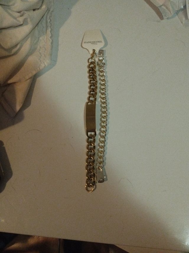 Dos esclavas de plata y acero inoxidable