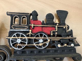 Campana de hierro fundido con locomotora a vapor