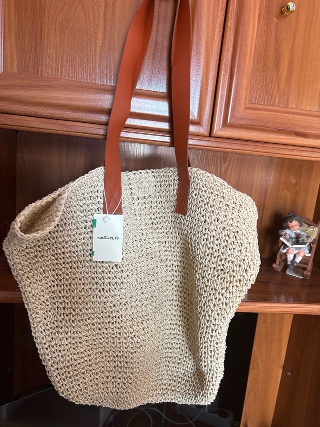 Bolso firma “Natura”