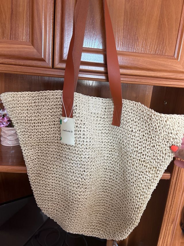 Bolso firma “Natura”