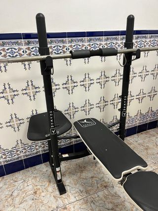 Máquina multifunción y mancuernas