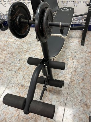 Máquina multifunción y mancuernas