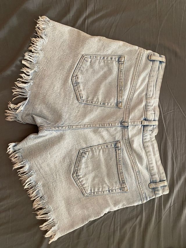 Pantaloni in denim con piume