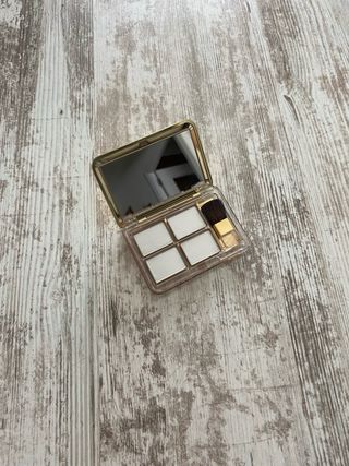 Espejo Estee Lauder dorado