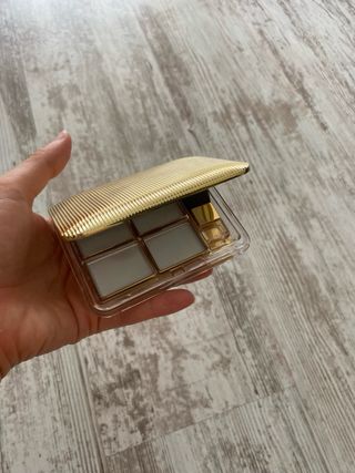 Espejo Estee Lauder dorado