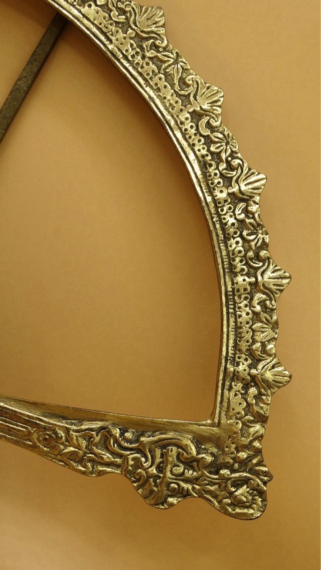 Abanico antiguo de bronce