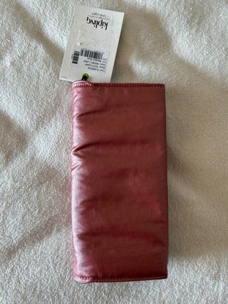 Monedero Kipling grande color rosa metalizado
