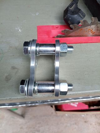 Elevador amortiguador trasero