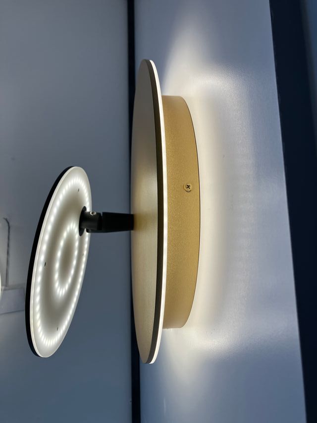 Lampada parete oro/nero Led effetto "eclisse"