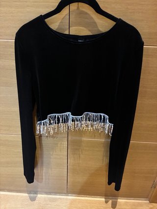 Conjunto top de manga larga y minifalda