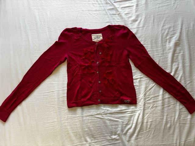 Chaqueta de punto fuxia con lacitos Hollister