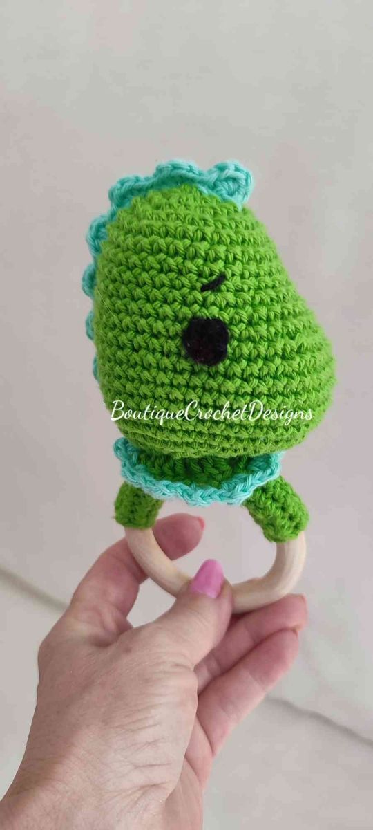 Chupetero y sonajero Dino