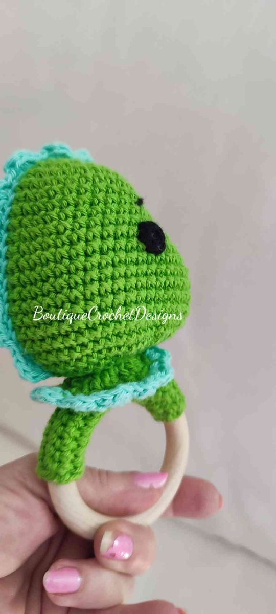 Chupetero y sonajero Dino