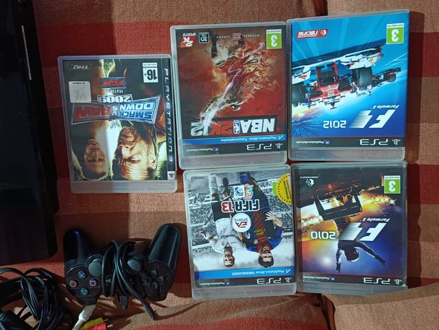 PlayStation 3 + Mando + 5 Juegos