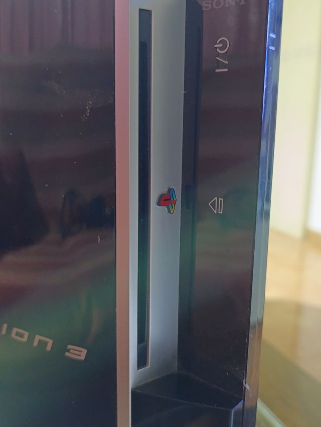 PlayStation 3 + Mando + 5 Juegos