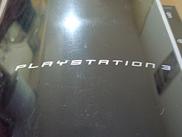 PlayStation 3 + Mando + 5 Juegos