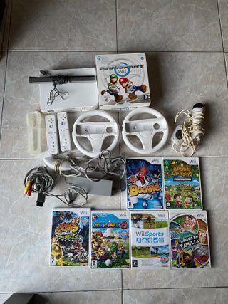 wii con 2 mandos, juegos y volantes para mariokart
