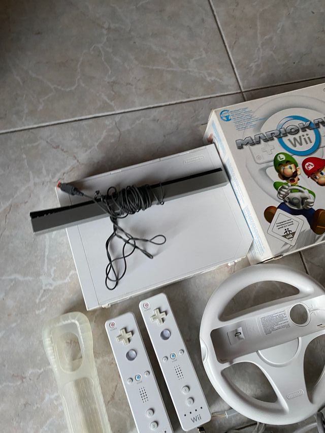 wii con 2 mandos, juegos y volantes para mariokart