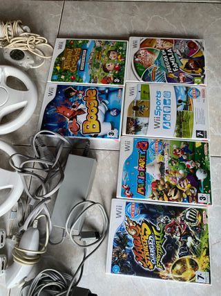 wii con 2 mandos, juegos y volantes para mariokart