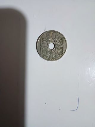 50 céntimos 1949 flechas invertidas.