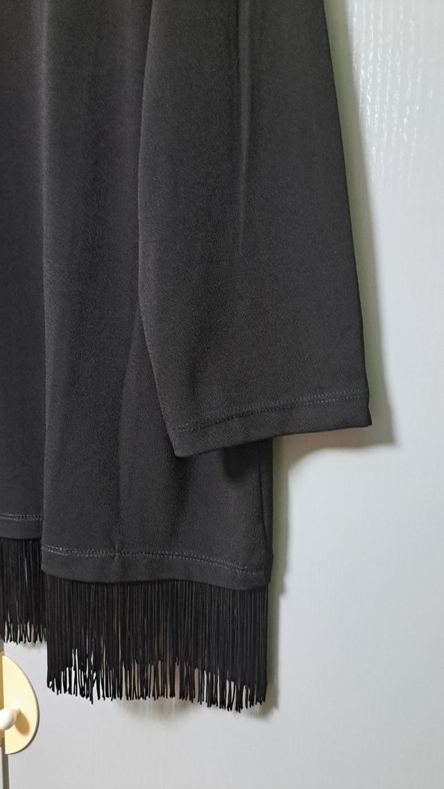 Jersey con flecos