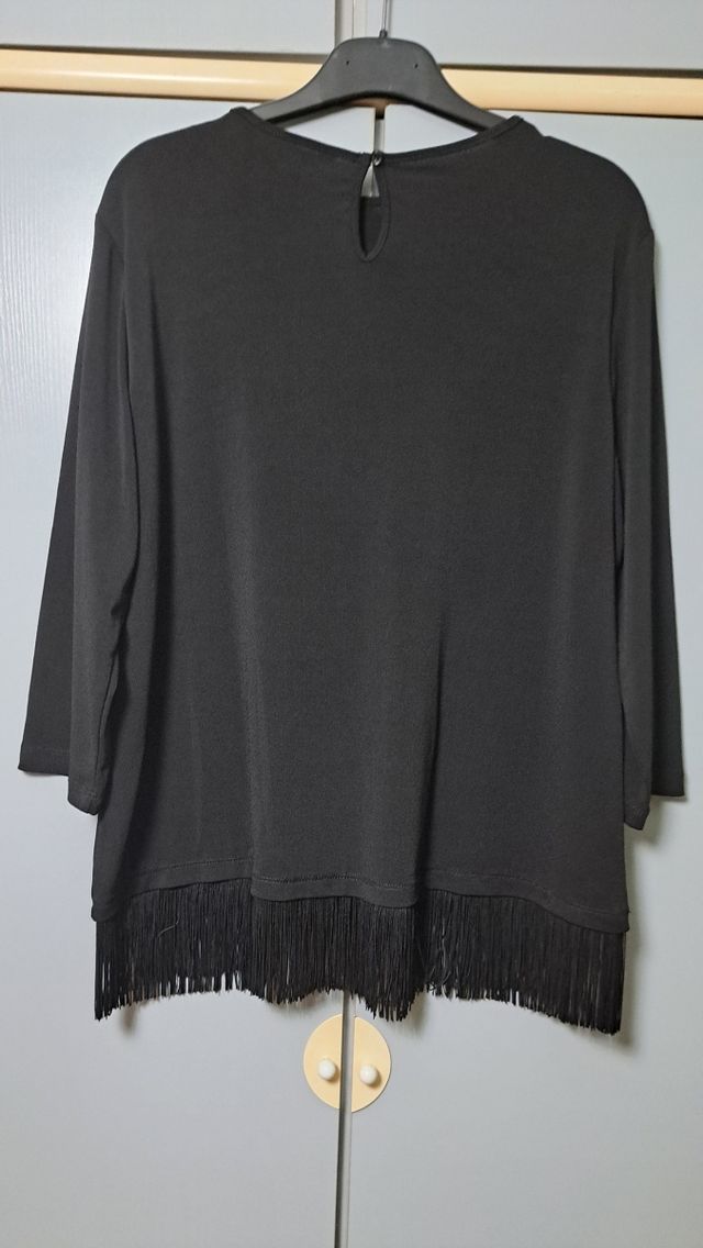 Jersey con flecos
