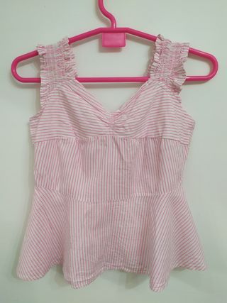 Blusa original a rayas con lazo trasero