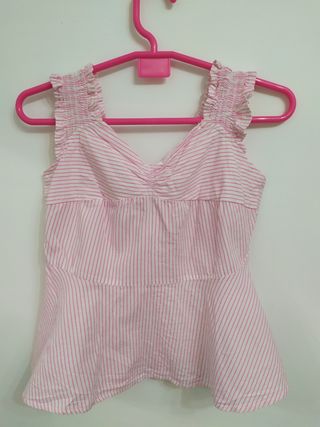 Blusa original a rayas con lazo trasero