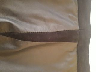 Falda de cuero negra de mango.Es talla 38,40