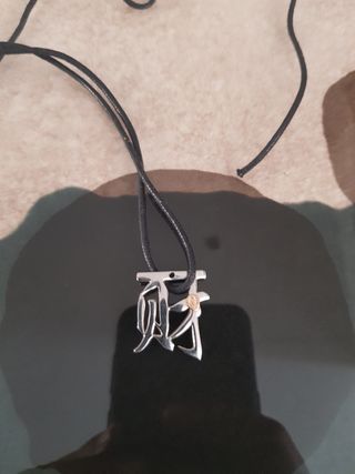Ideogramma in acciaio con sigillo in oro 18k