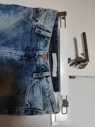 Minifalda denim elástico con detalles encaje