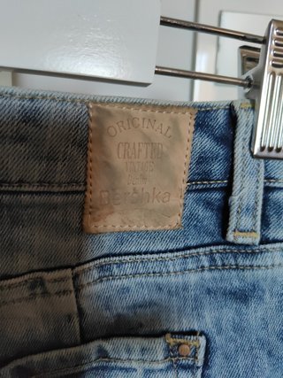 Minifalda denim elástico con detalles encaje