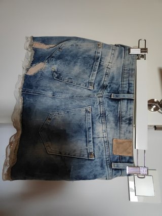 Minifalda denim elástico con detalles encaje