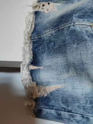 Minifalda denim elástico con detalles encaje