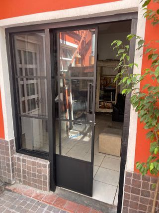 PUERTA CORREDERA ESTILO GRANERO VIDRIOS REPARTIDOS