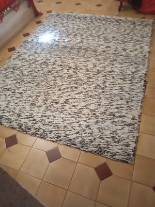 Alfombra antigua queda muy bonita