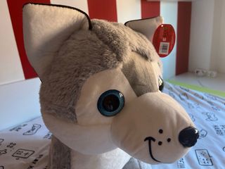 Perro de peluche ojos brillantes ,