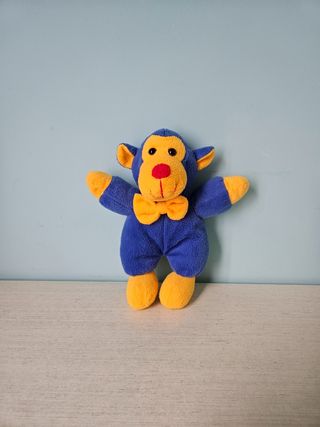 Scimmietta peluche giallo e blu
