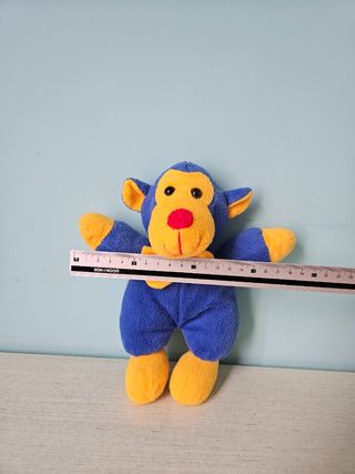 Scimmietta peluche giallo e blu