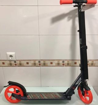 Patinete OXELO MID 7. Naranja y negro.